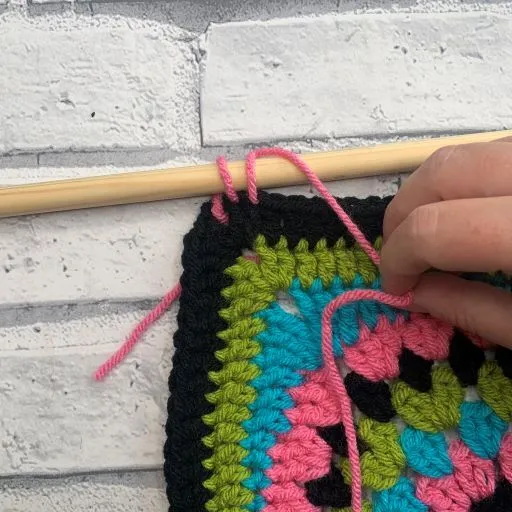 How to attach a dowel to a crochet wall hanging